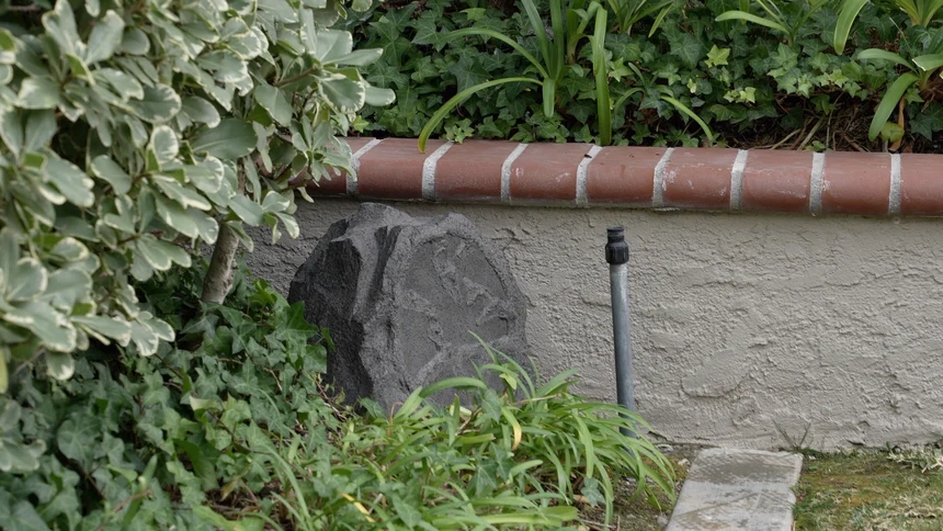 Luxury outdoor garden landscape with high-end weatherproof speakers in Dubai villa